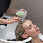 woman applying green tea for hair 