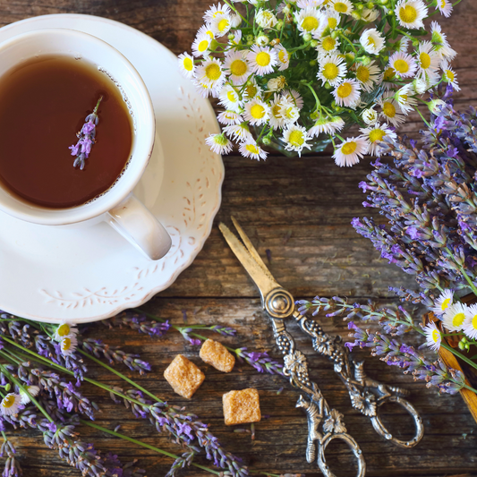 cup of stress relieving lavender tea next to herbs