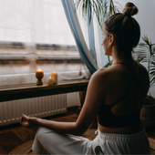 woman in a yoga pose at home