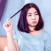 stressed woman pulling her hair